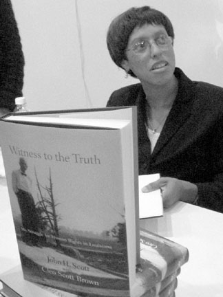 Author and civil rights activist Cleo Scott Brown signs copies of her book Witness to the Truth (Diana Diroy)