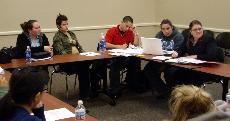Members of the student council for a meeting discussing future plans for campus events ()