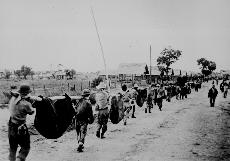 Philippine Army soldiers carrying their dead to Camp O Donnell (WWW.ANSWERS.COM)