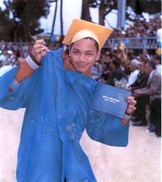 Justin Mendoza in happier times poses for his graduation. (Courtesy of the SF Chronicle)
