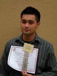 Tolentino holds up his first place award from the American Society of Micro-Biology (Jonathan Tolentino)