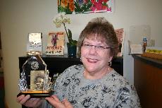 Daly showcasing her award ()