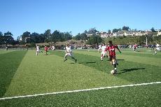 Edward McKinley speeds down the soccer field in the hopes of scoring a goal. ()