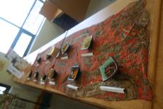 Barbara Daley's display of a series of arranged spices with a placard stating their spiritual meaning as stated in "The Mistress of Spices." ()