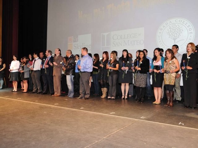 Phi Theta Kappa Inductees Prepare to Swear Oath of Membership in Honor Society. (David Evans)