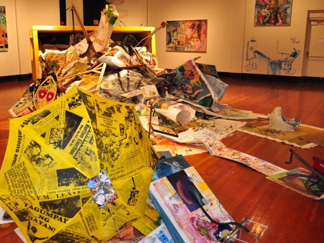 Found objects spill out of the dumpster instalation, including a unbrella from Manilla. (Milan Subedi/The Skyine View)