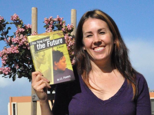Skyline English teacher Jessica Powers, with pen name J.L., shows off her new novel. (Timothy Marasigan)