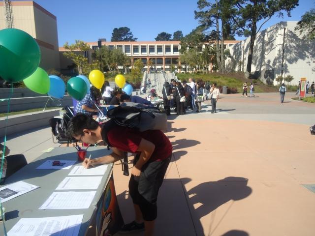 Students busy themselves at the club fair, learning about the numerous clubs on campus. (JJ Valdez)