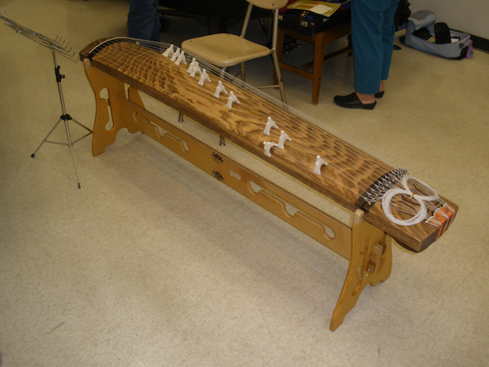 This is a koto, a Japanese instrument ()