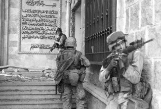 United States Marines storm Saddam Hussein’s palace. 