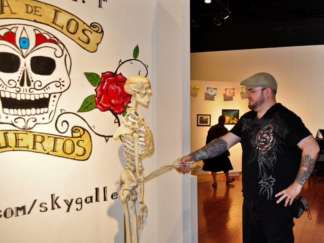 Student and rising artist Jason Thomason, gets friendly with the dead. (Milan Subedi)
