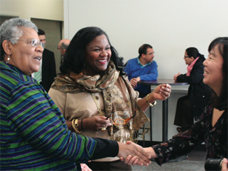 Professor Minnijean Brown-Trickey (left) meets with students and fellow professors.