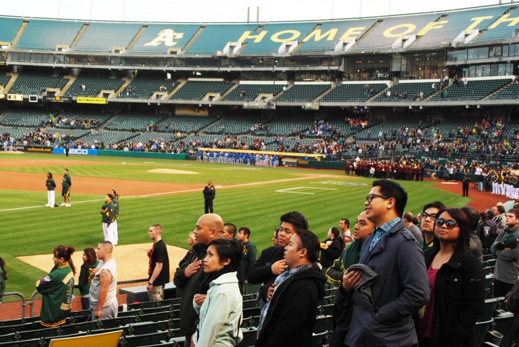 Fans rise throughout the stadium for the National Anthem before the game. (Terence Chin)