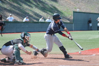 Mark Hurley swings and misses on a curve-ball in the dirt.  (Renee Abu-Zaghibra)