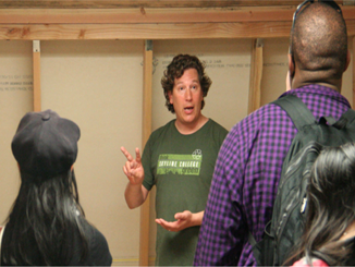 Bruce Greenstein (right) gives a work tutorial to students in the newly built Solar and Building Science Learning Center.