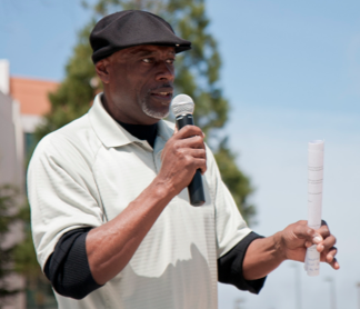 Oscar Grant’s Uncle, Cephus Johnson, speaks to a group of students. (Daniel Chee)