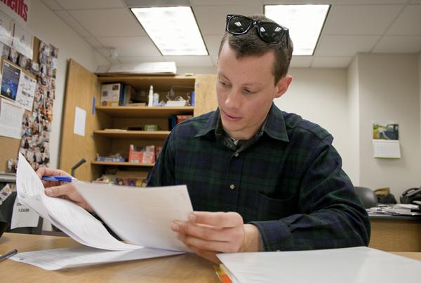 Biology student Andrew Diehl fills out his MESA laptop paperwork.