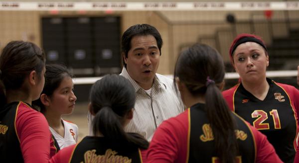 Coach Ed Parker talks with his team during a timeout at the Nov. 7 game.