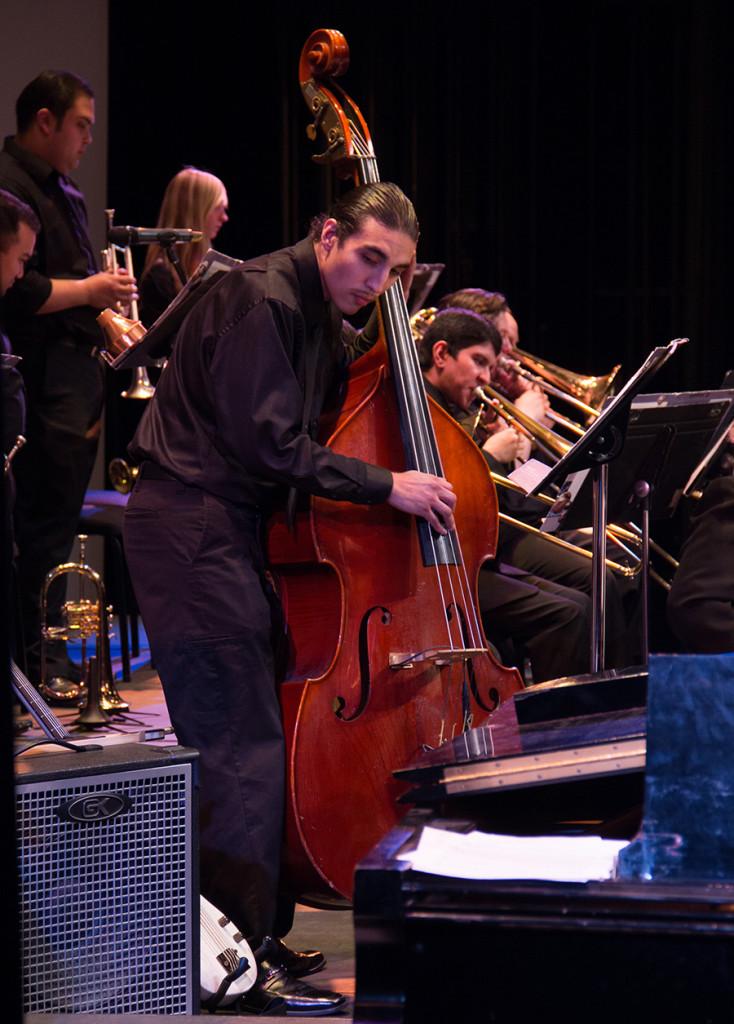 Alexander Rosales plays the bass during the Skyline College Jazz band’s performance of Quincy Jones’ arrangement of “Killer Joe”.