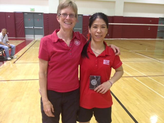 Anna Nguyen (right) poses for a picture with her head coach, Jan Fosberg.