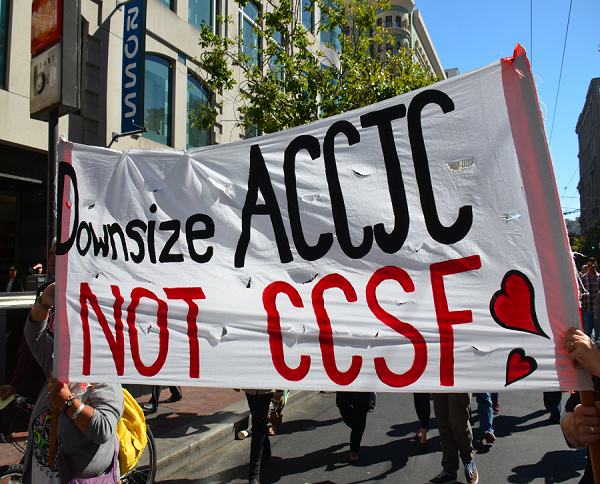 Students protest during a March 2013 rally against the closure of their school.