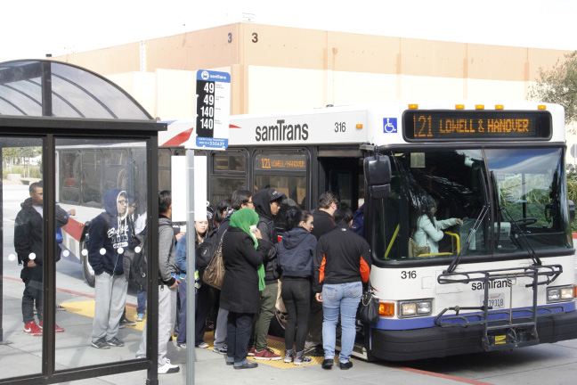 Students board a crowded bus after the alternative route had been discontinued.