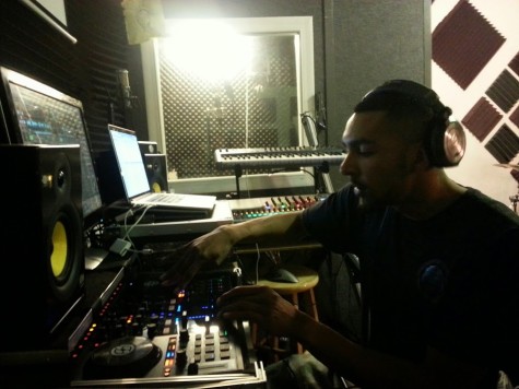 Aaron mixing beat in the studio. 
