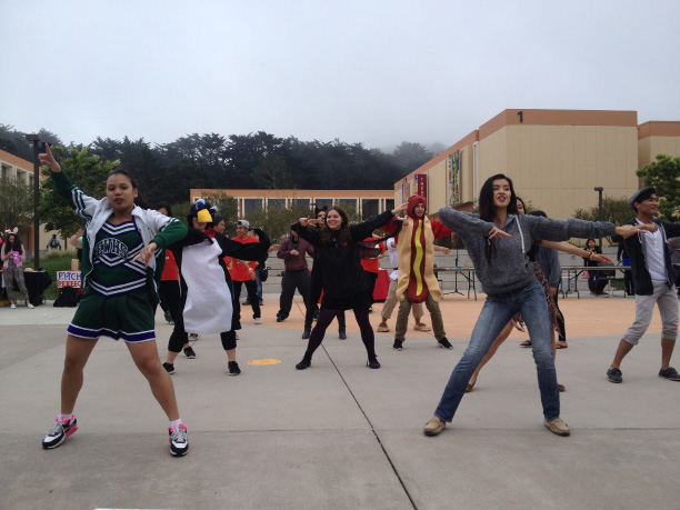 Jalayna Schneider (second from left), Jennifer McAdams (center) and the Skyline dance department perform their “Dynamite” flashmob in celebration of Skylloween. 