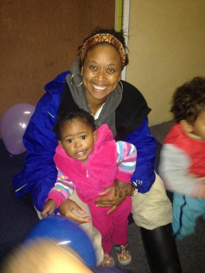 Washington with Mbesa, a child from the Cape Town day care who lit the desire in her to teach abroad.