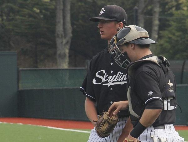 Trojans Kyle Vallans (#43) talking with the catcher at the March 14 game.  