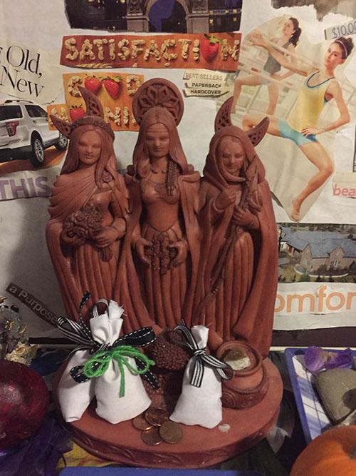A personal alter dedicated to Hecate and her two other forms(left to right) Diana, Selene and Hecate, with offerings of fruit and herb filled satchets. Photo credit: Laurel B. Lujan