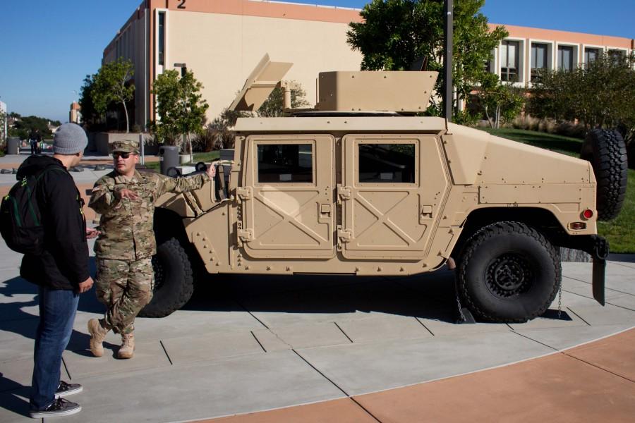 Sergeant Michael J. Marl speaks to a student during the campus Veterans Day event on Nov. 11