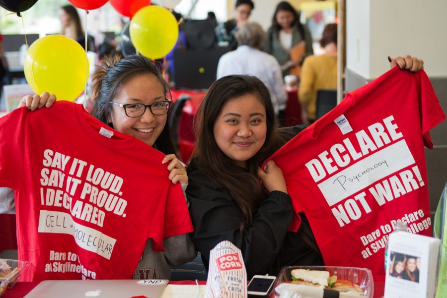 ASSC+members+Ashley+Cabrera+and+Allyson+Roa+display+their+majors+on+the+Dare+to+Declare+t-shirts.