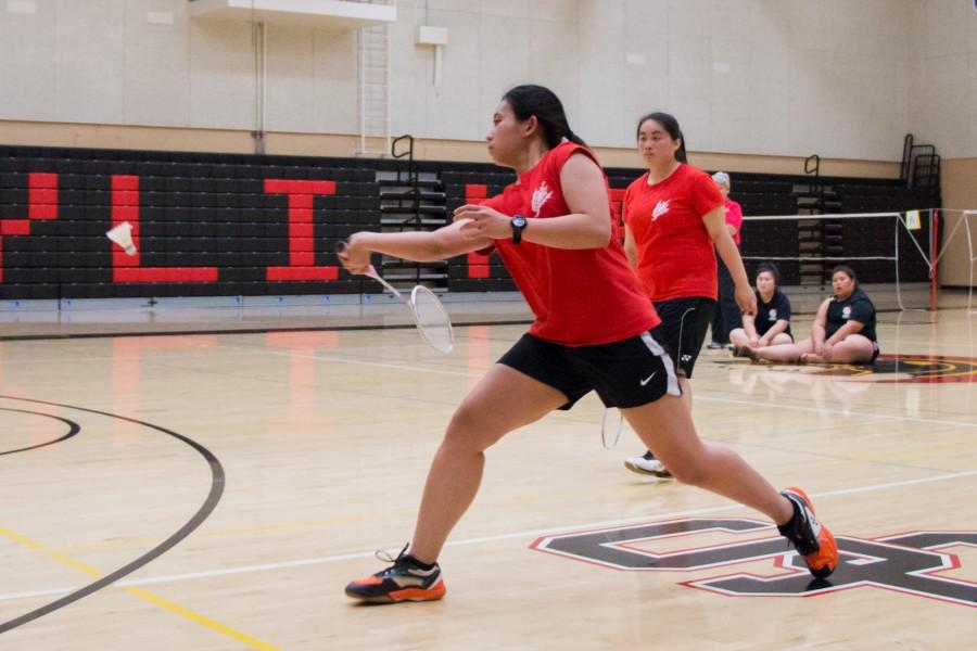 Carla Montanes hits the shuttlecock to rally her opponent in a game against the Fresno Rams at Skyline College on Tuesday, April 5, 2016. 