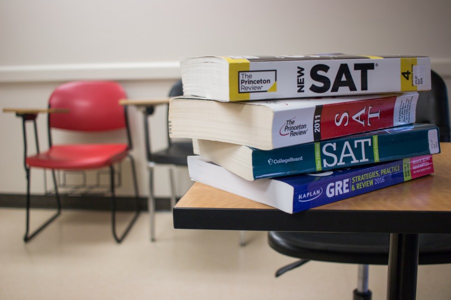 A stack of SAT prep books sits on a desk in an empty classroom on Wednesday, April 6, 2016.