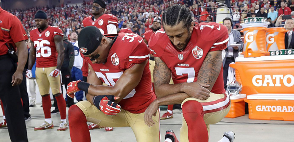 Eric Reid and Colin Kaepernick of the San Francisco 49ers continue their protest of racial injustice during the national anthem on Sept. 11, 2016.