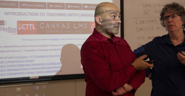 Ricardo Flores and Bridget Fischer teaching faculty how to use Canvas, on August 29, 2016 at Skyline College.