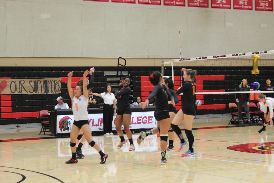 The team celebrates as a group after a score against Foothill College on Nov. 23, 2016. 