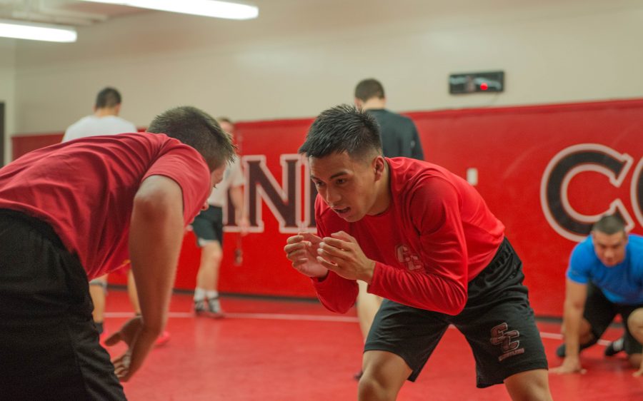 Aaron Aquino and Tanner Robson drill takedowns during practice on Nov. 29, 2016. 