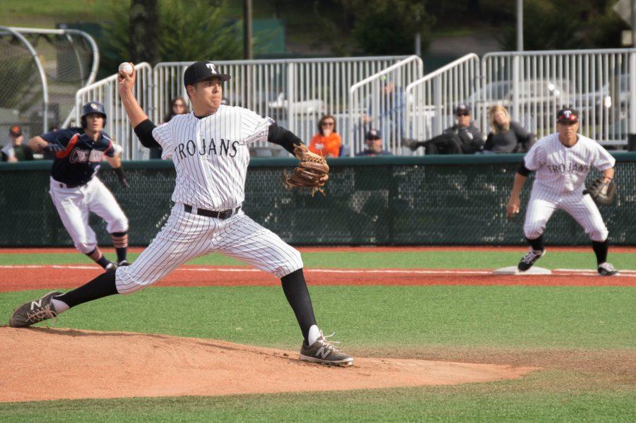 Ray Falk pitches the ball against Cosumnes River College on Feb. 4, at Skyline College. 
