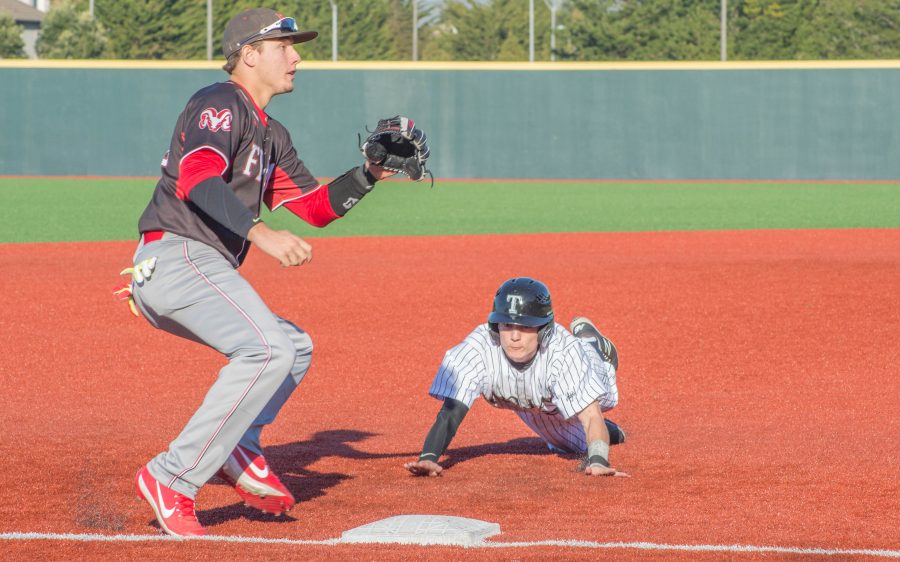 Harley Torres slides to steal third base against Fresno City College on Jan. 28, 2017. 