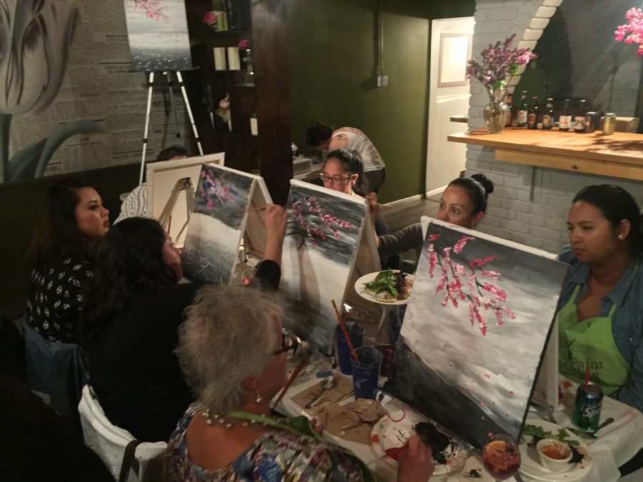 Participants at Paint Nite enjoyed a meal while painting at LaLe restaurant in San Francisco on April 12, 2017. Photo credit: Mintzhet Tan