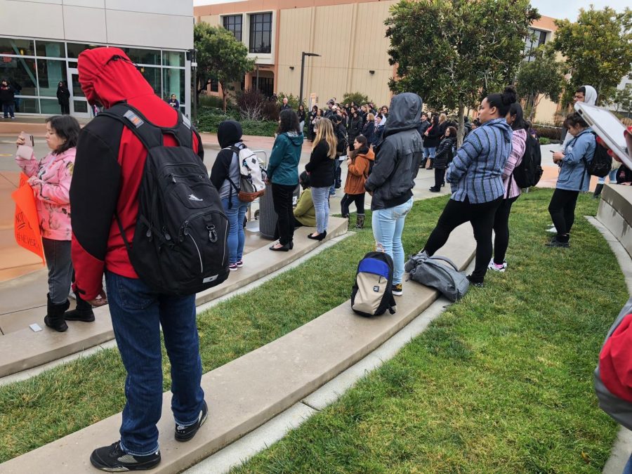 Students and teachers listen to the message from the President of Skyline College, Dr. Regina Stanback Stroud following the 17-minute moment of silence on March 14, 2018.