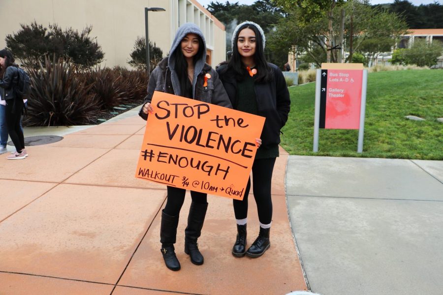 Charlene Maravilla (left) and Polly Saldana (right) show their solidarity for the victims of the Stoneman Douglas shooting on March 14, 2018.