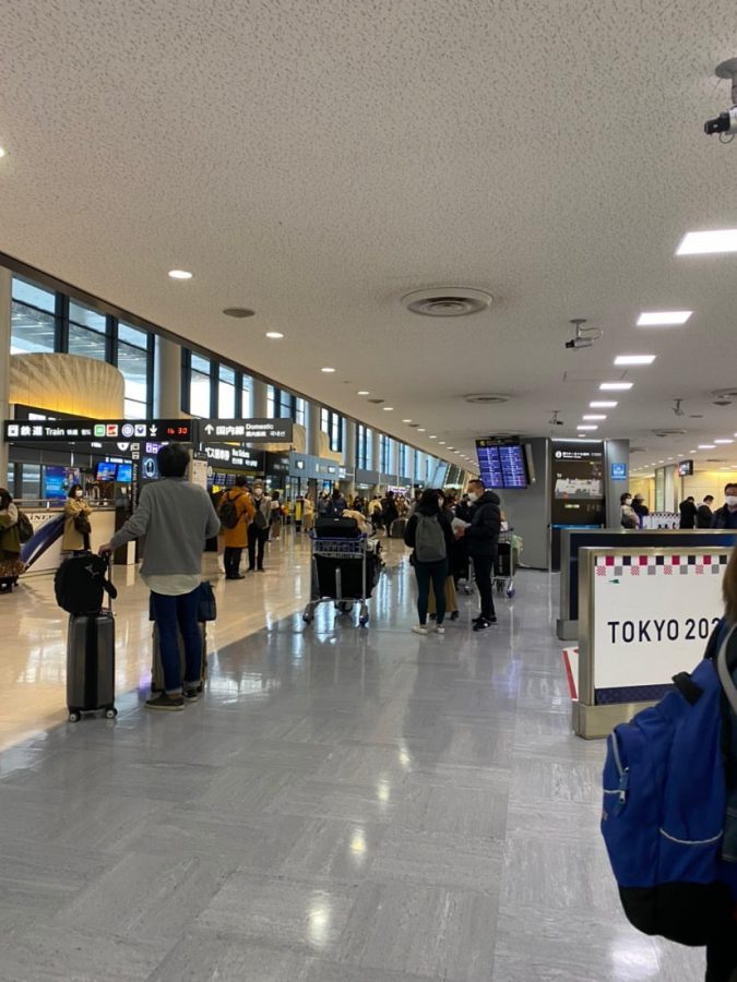 Passengers are seen wearing masks as a protective gear amid the COVID-19 pandemic at Narita International Airport, Tokyo, Japan. 