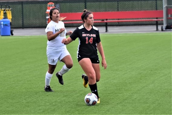 Keely Anderberg dribbles the ball upfield for Skylines women’s soccer team