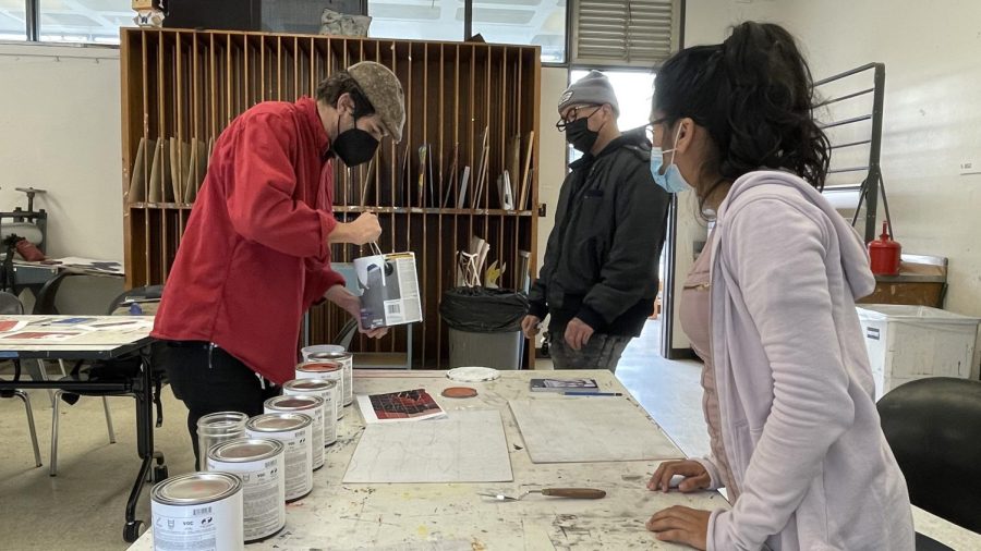 Professor Amir Esfahani prepares the color palette his class would use for their grid and scaling exercise