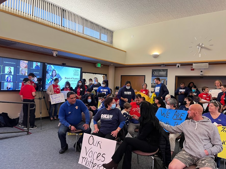 SMCCCD staff members rally during an October 26 Board of Trustees meeting