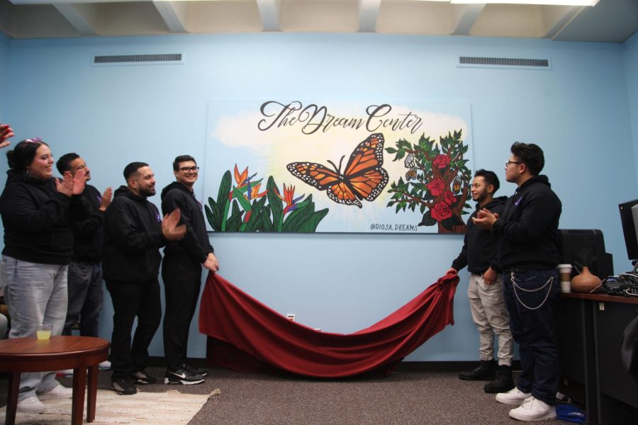 Artist Monica Navarro-Marroquín (far left) unveils her mural at the Skyline College Dream Center