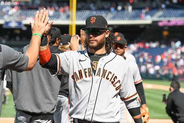 Brandon Crawford high fiving his teammates